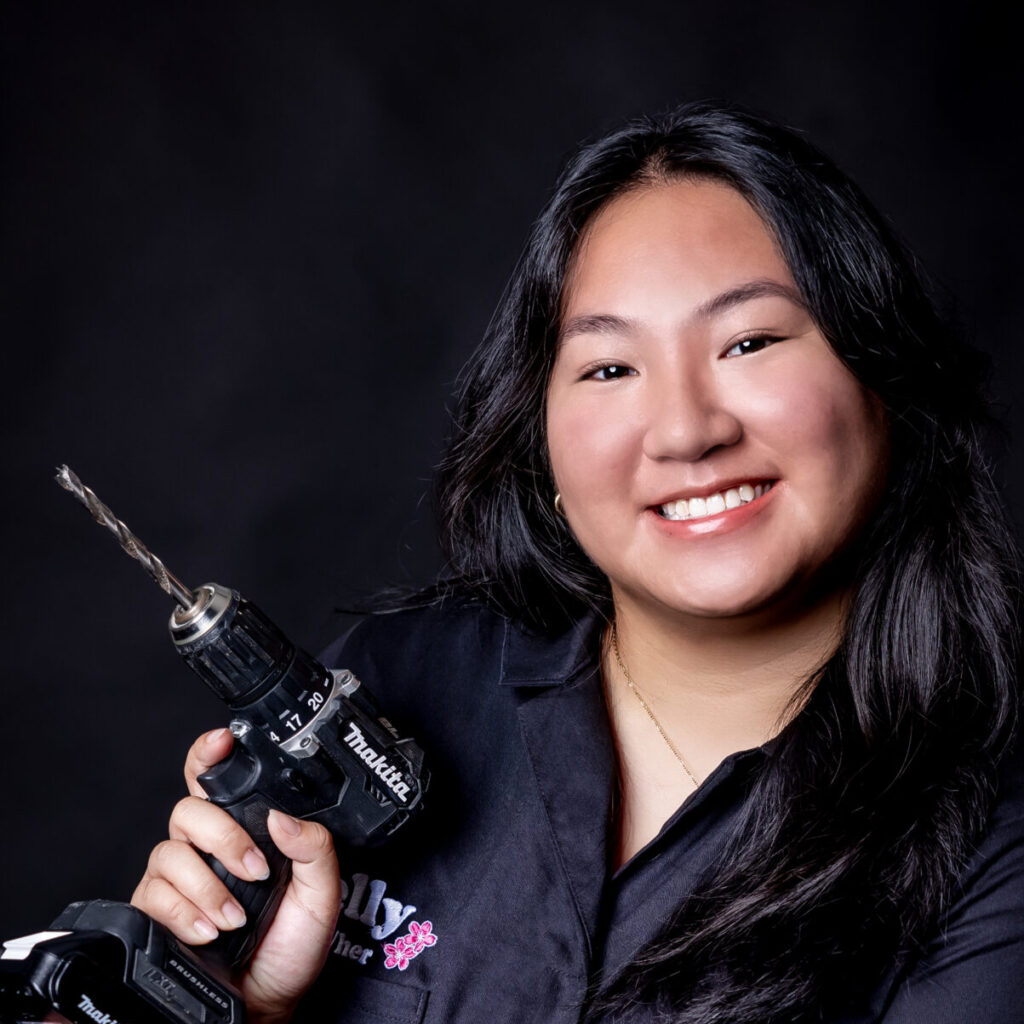 student portrait holding a drill