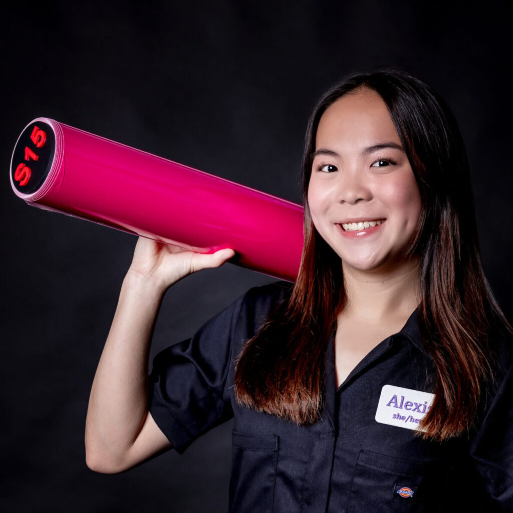 student portrait holding a vinyl roll