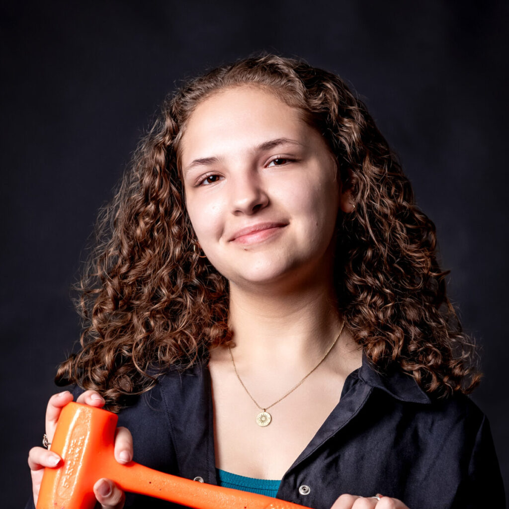 student portrait holding a hammer