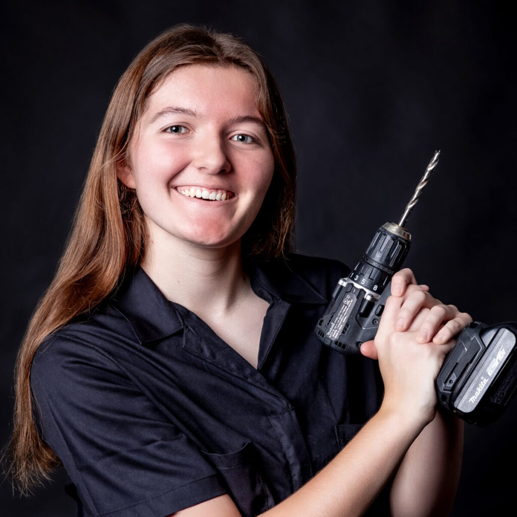 student portrait holding a drill