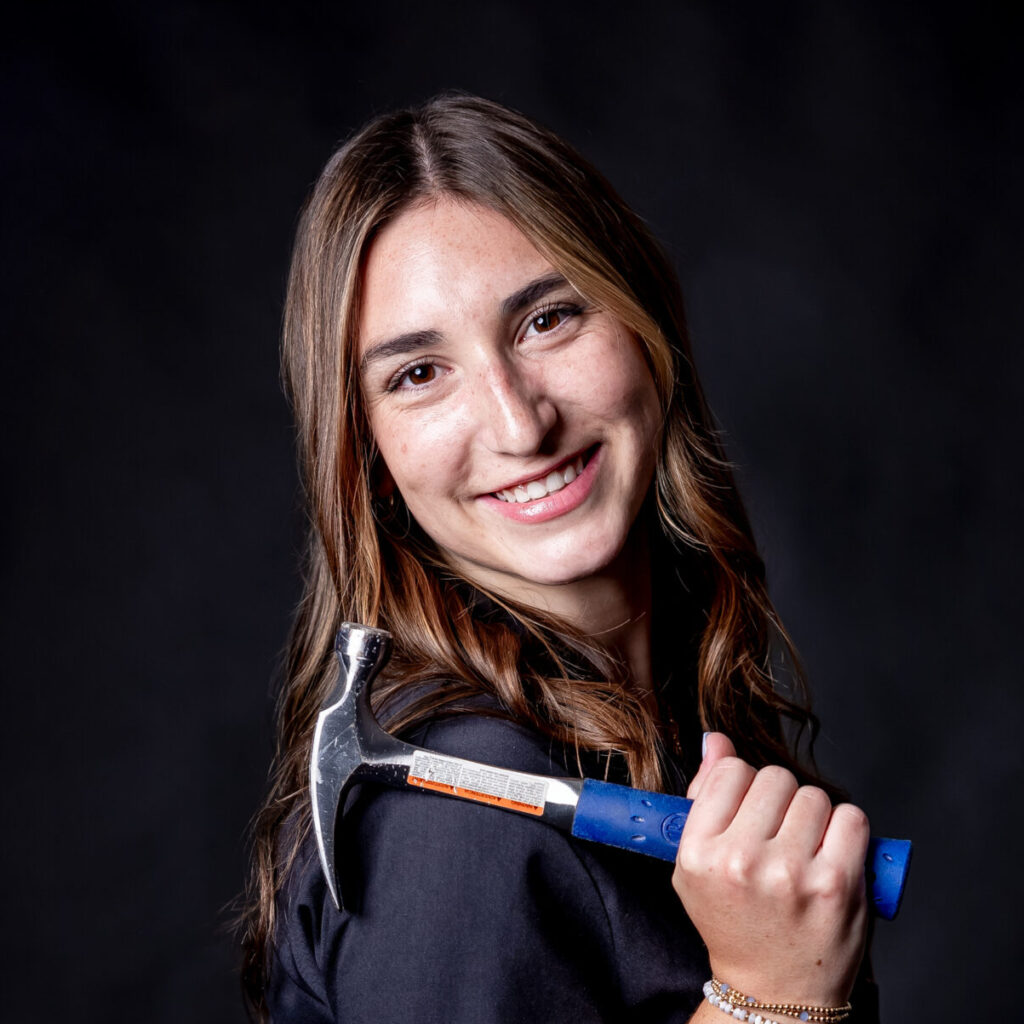 student portrait holding a hammer