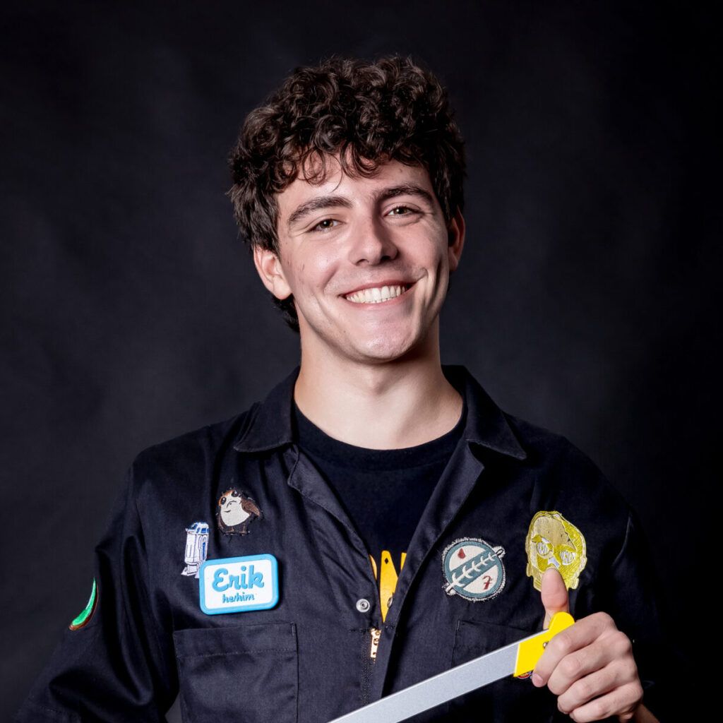 student portrait holding a saw